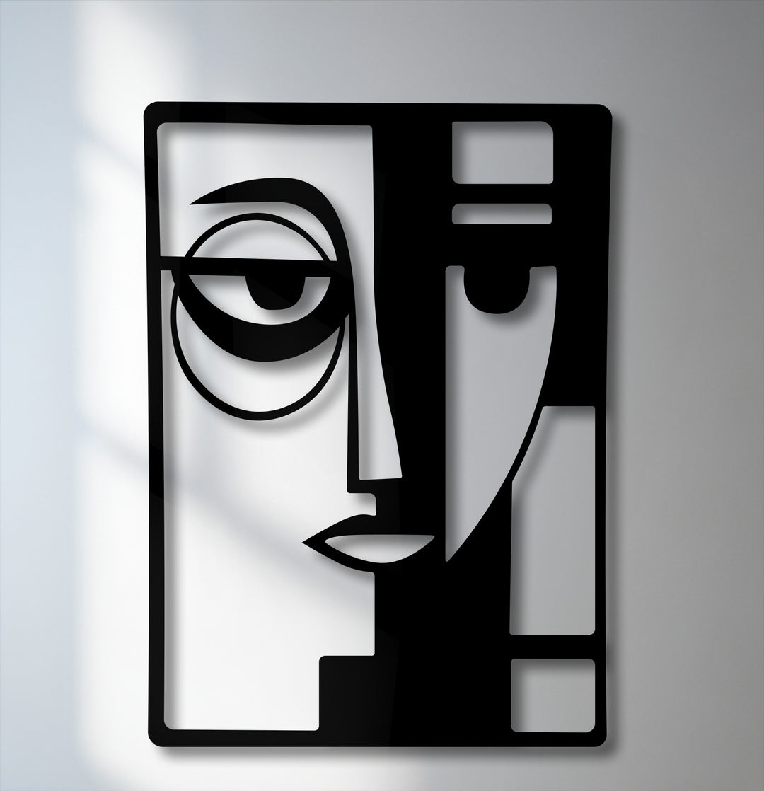 The darkest area reveals a striking, geometric abstraction of a dual face, forming a captivating modern metal wall decor piece.