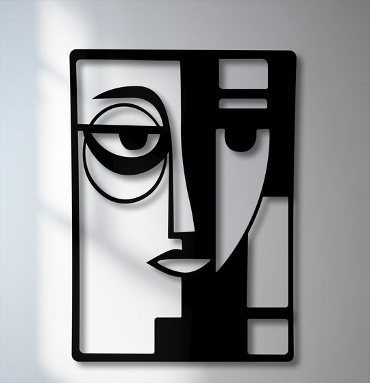 The darkest area reveals a striking, geometric abstraction of a dual face, forming a captivating modern metal wall decor piece.