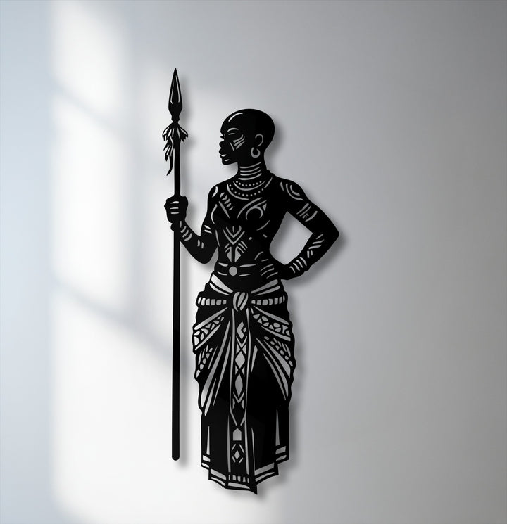 A striking transition from the bright wall to the powerful black silhouette of the Cultural African Warrior metal art for wall.