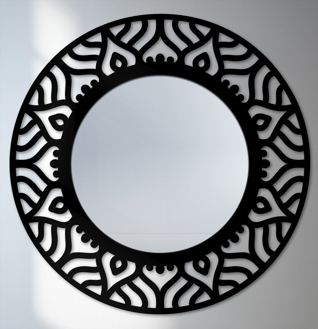 Focusing on the intricate pattern, this modern round black metal mirror exemplifies decorating with wall mirrors, blending form and function in captivating home decor.