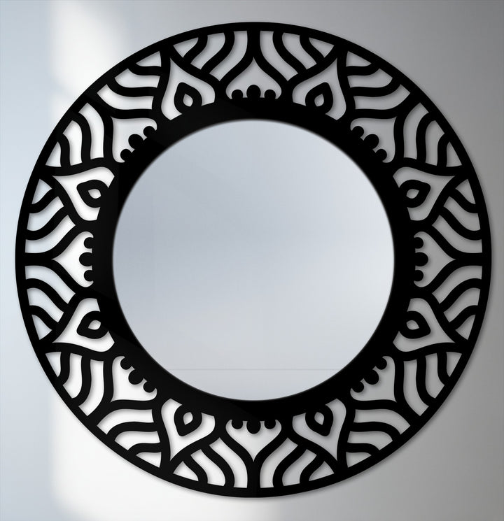 Focusing on the intricate pattern, this modern round black metal mirror exemplifies decorating with wall mirrors, blending form and function in captivating home decor.