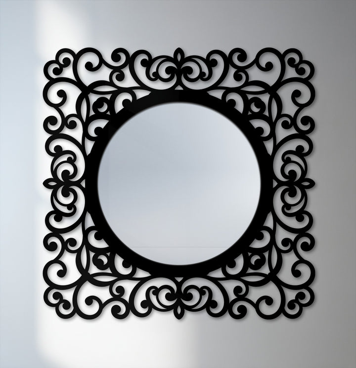 The decorative mirror's baroque scroll frame creates a pleasing visual rhythm with its alternating curves, enhancing the round mirror's elegant presence.