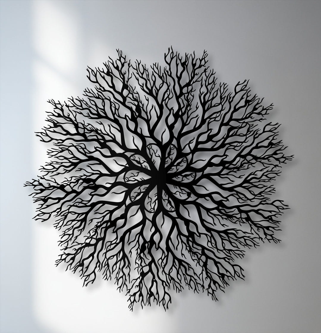 The abstract quality of this intricate tree roots mandala metal wall decor features silhouetted branches in a circular, nature-inspired design.