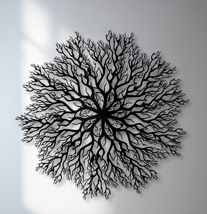 The abstract quality of this intricate tree roots mandala metal wall decor features silhouetted branches in a circular, nature-inspired design.