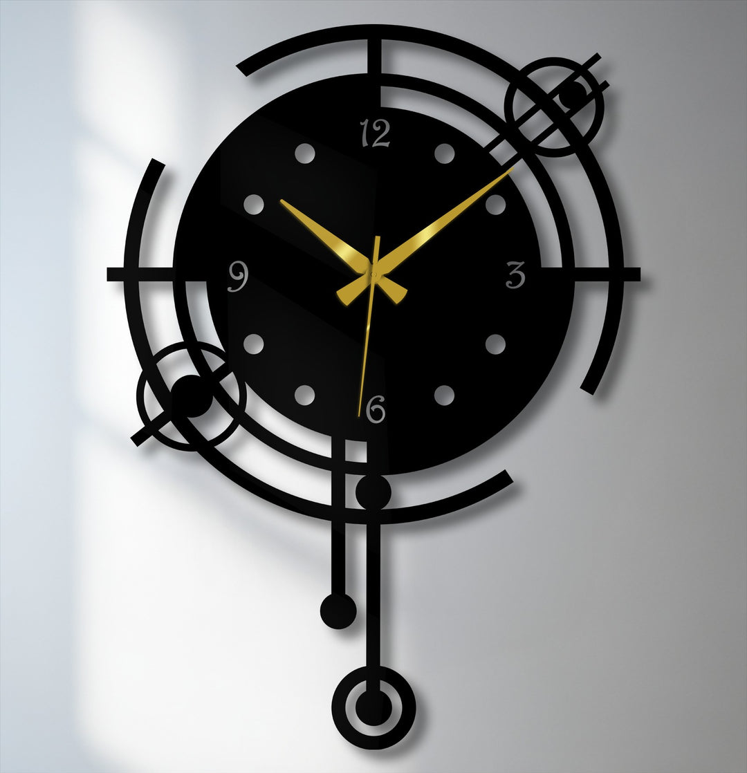 Reduced color saturation highlights the modern orbit geometric metal wall decor clock, featuring a black frame and golden hands.