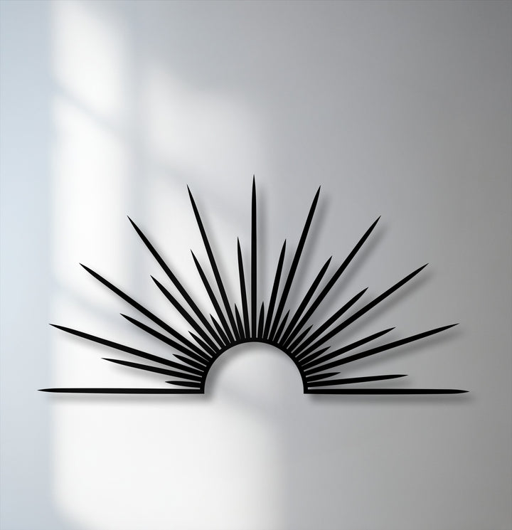 The radiant sunburst metal art for wall creates a distinct layering effect through its silhouette and pronounced shadow.