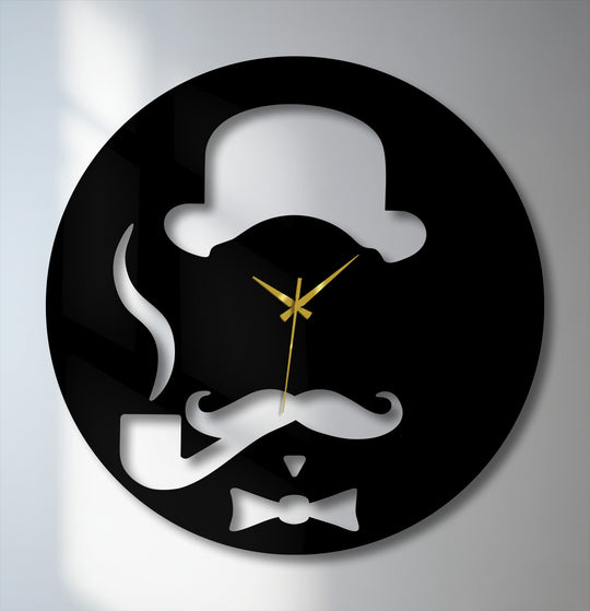 A striking black metal artwork wall clock features a dapper gentleman's silhouette with a bowler hat, mustache, pipe, bow tie, and golden hands.