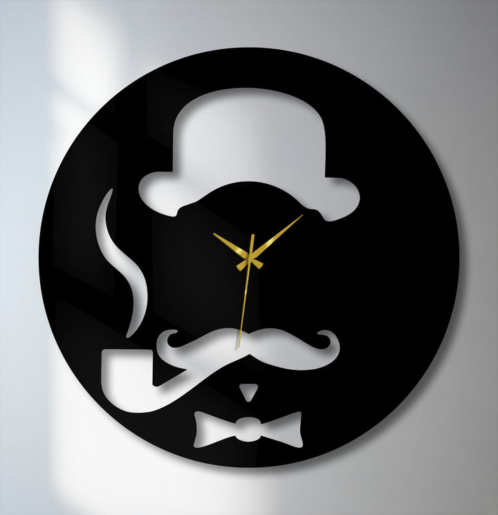 A striking black metal artwork wall clock features a dapper gentleman's silhouette with a bowler hat, mustache, pipe, bow tie, and golden hands.