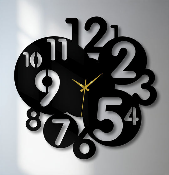 The modern metal wall decor clock exudes a sophisticated and minimalist mood with its bold abstract numbers and elegant gold hands.