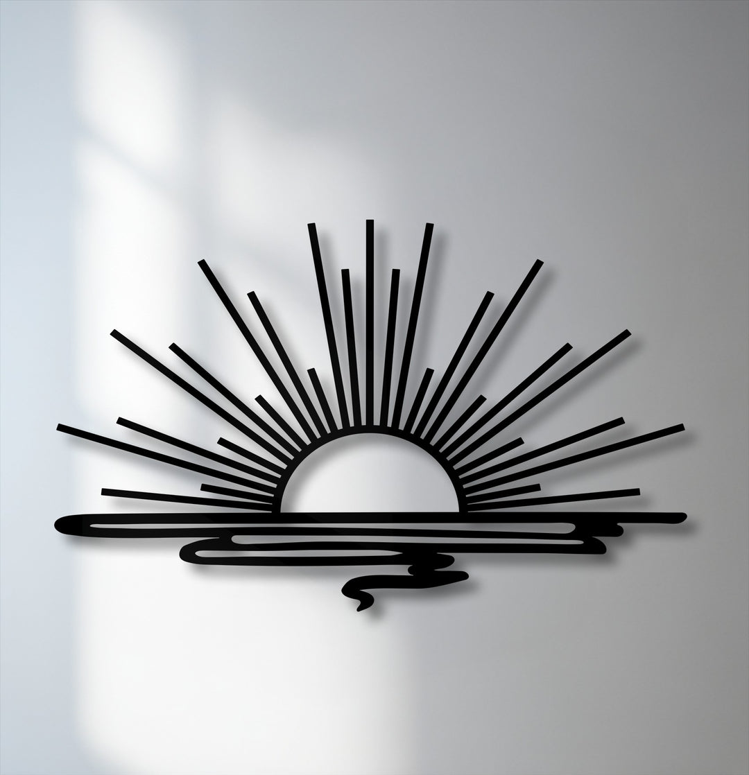 The organic forms of the unique metal wall art depict a minimalist sunrise with radiant beams over undulating water, creating a serene, modern design.