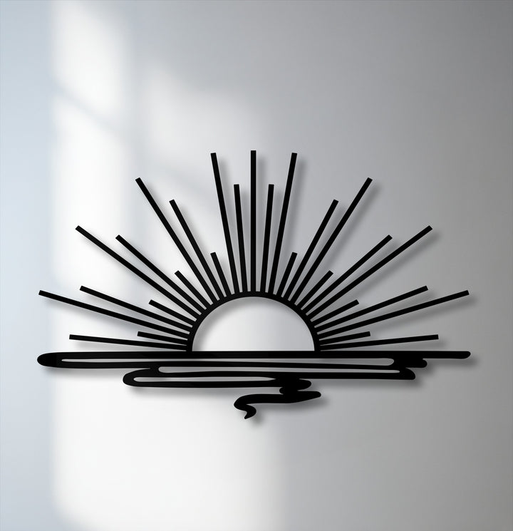 The organic forms of the unique metal wall art depict a minimalist sunrise with radiant beams over undulating water, creating a serene, modern design.