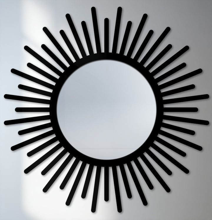 Subtle, textured white wall serves as a minimalist backdrop for this sunburst round floor mirror, enhancing the black frame and creating depth with modern wall mirrors.