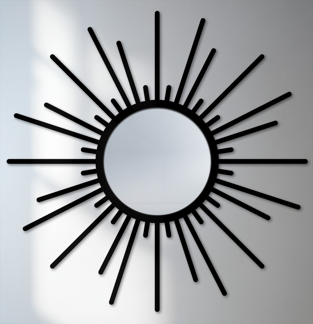 Minimal color saturation defines this modern sunburst mirror with a black frame, offering a striking example of a framed wall mirror for stylish home décor.