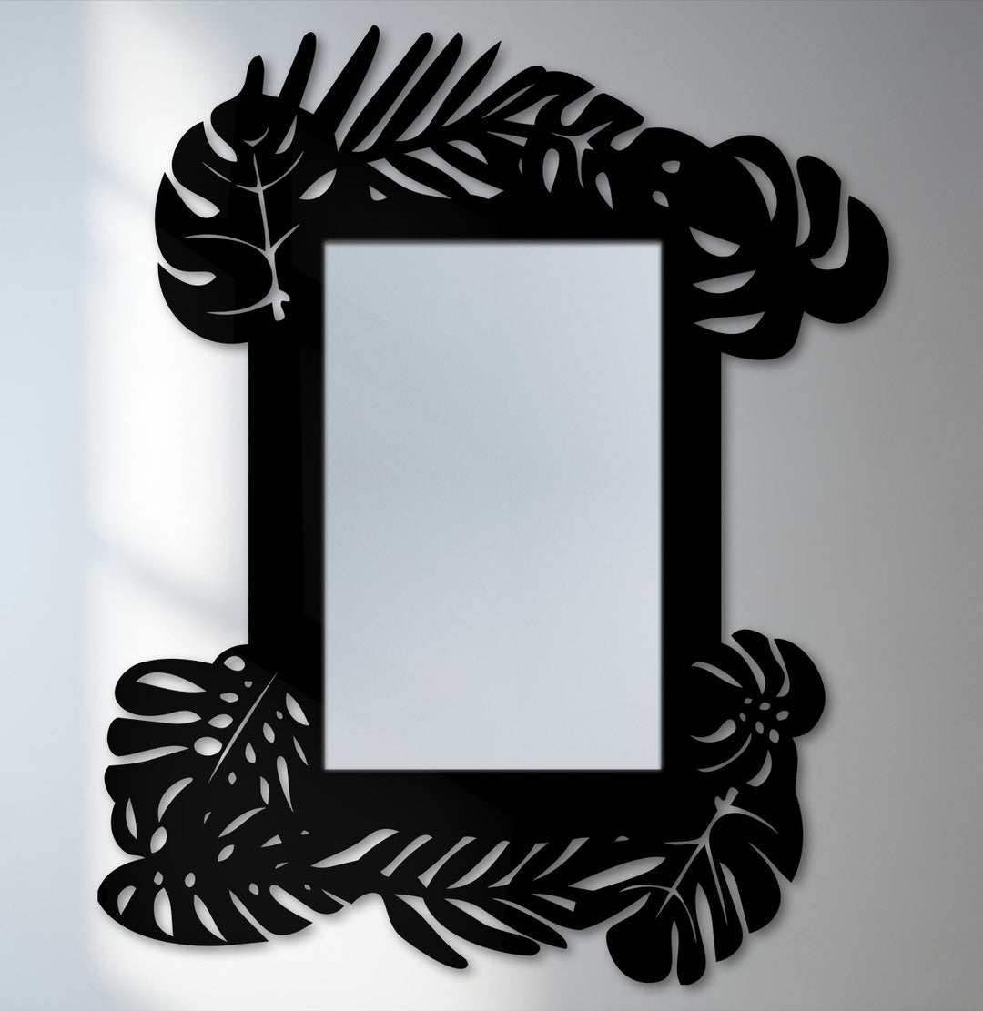 The brightest area highlights the reflective center of this tropical leaf frame metal art for wall mirror, offering a botanical statement design with sharp contrasts.