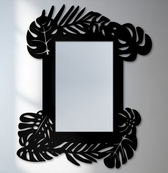 The brightest area highlights the reflective center of this tropical leaf frame metal art for wall mirror, offering a botanical statement design with sharp contrasts.