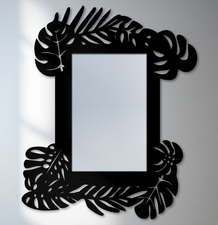 The brightest area highlights the reflective center of this tropical leaf frame metal art for wall mirror, offering a botanical statement design with sharp contrasts.