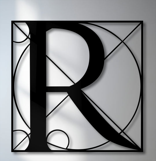 Striking geometric lines and circles intricately form a stylized letter R, presenting captivating metal wall decor with depth.