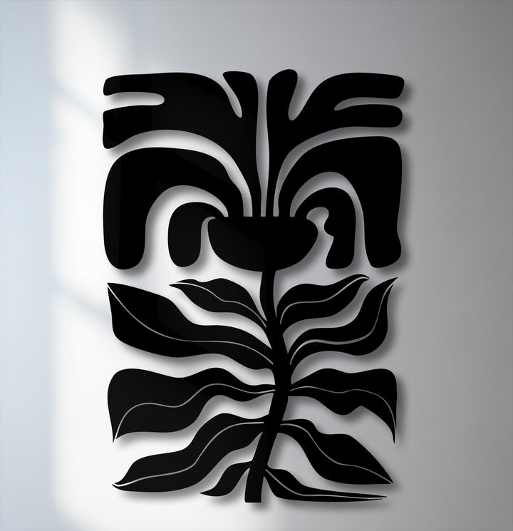 Organic forms flow in this abstract floral face metal art for wall, showcasing a modern botanical line design on a white wall.