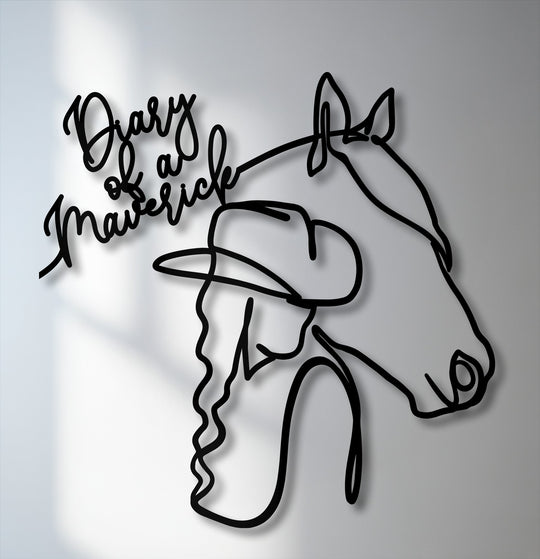 The realistic detail of this black metal artwork features a 'Diary of a Maverick' cowgirl and horse line art, casting lifelike shadows.