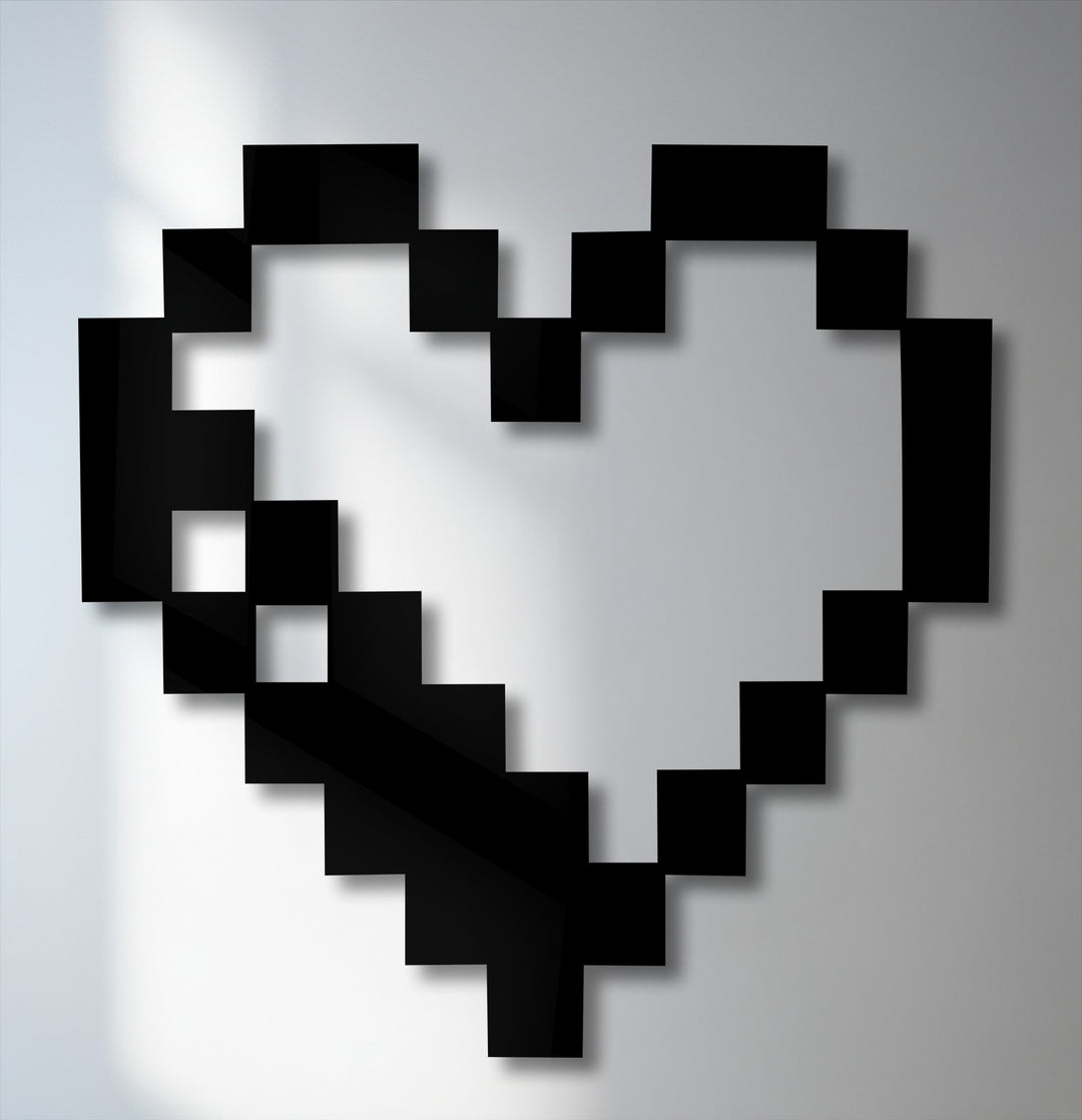 A sharp contrast between the bold black pixel heart and the light grey background creates a striking piece of decorative metal art.