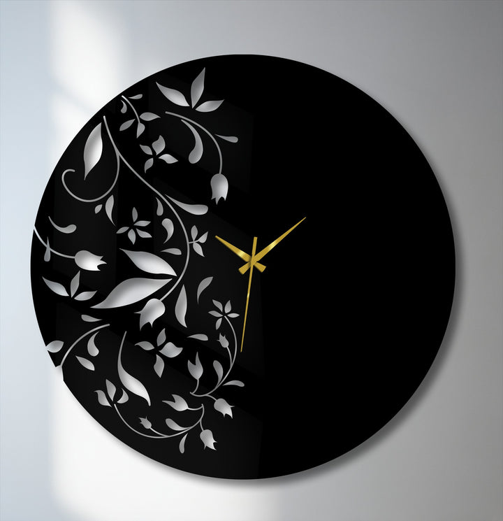 Highlighting the edge and borders, this metal wall clock features a minimalist leaf design with tempered glass wall art, blending style and function.