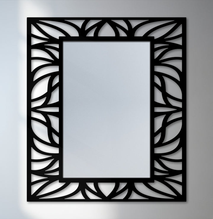 Minimal color saturation highlights the contrast in this modern decorative mirror, showcasing the black metal design of its organic leaf pattern frame.