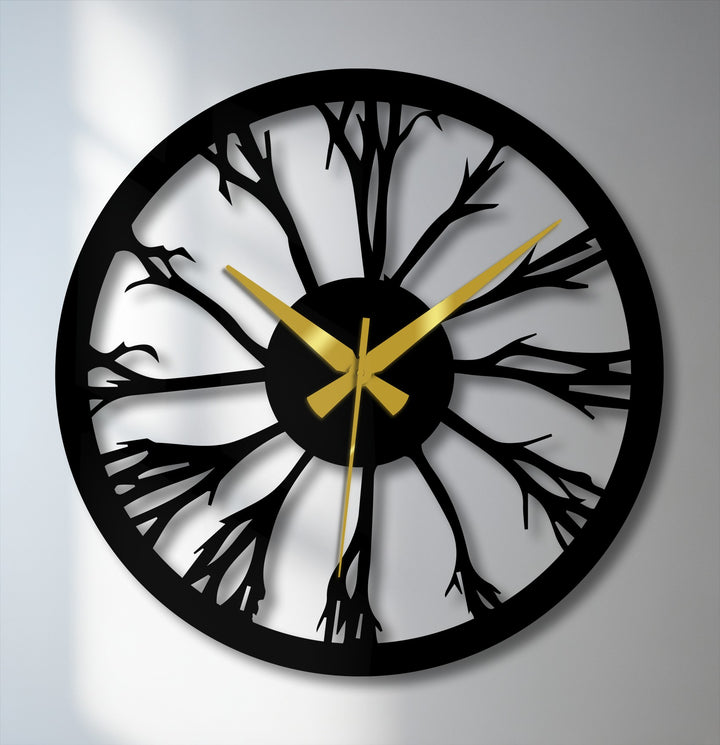 Foreground detail reveals a tree silhouette within this unique metal wall clock, a striking example of decoration wall art inspired by nature.