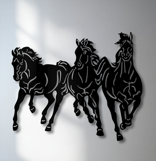 A dynamic trio of galloping horse silhouettes forms striking metal art for wall, showcasing their powerful movement.