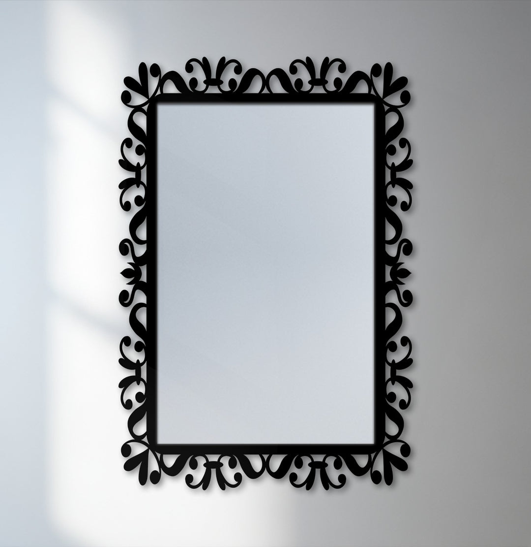 Depth is created by the delicate vine scrollwork of the bathroom mirror frame, contrasting against the reflective glass.