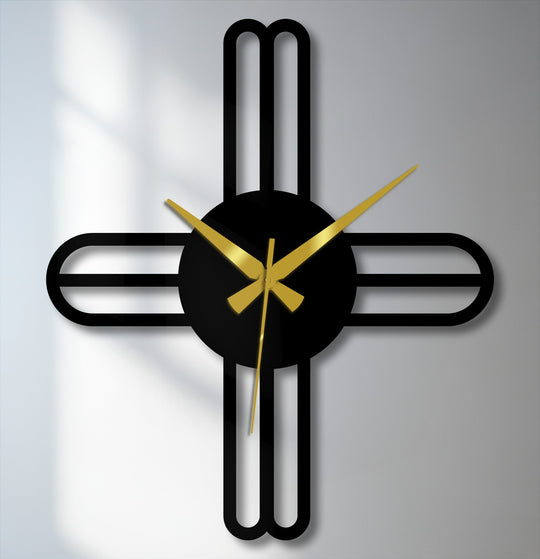 Featuring a smooth, matte finish, this modern cross line minimalist metal wall clock is an example of decorative metal art with its sleek black lines and gold hands.
