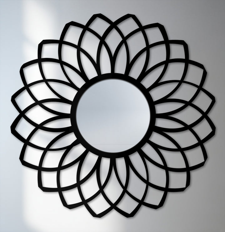 The saturated black on the layered petal design of this framed wall mirror creates a bold contrast, enhancing its unique and decorative appeal.