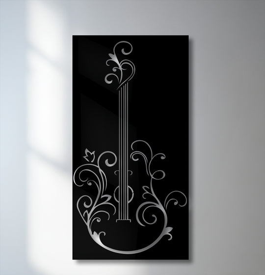The serene mood of this elegant guitar silhouette metal wall decor features intricate silver floral designs on a deep black panel.