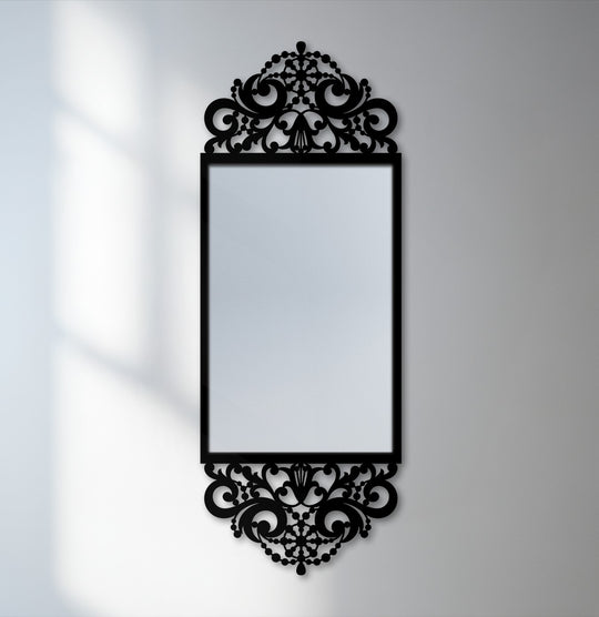 Showcasing the layering effect, the black metal scroll frame surrounds the ornate baroque mirror, presenting a striking combination of home decor and unique design.