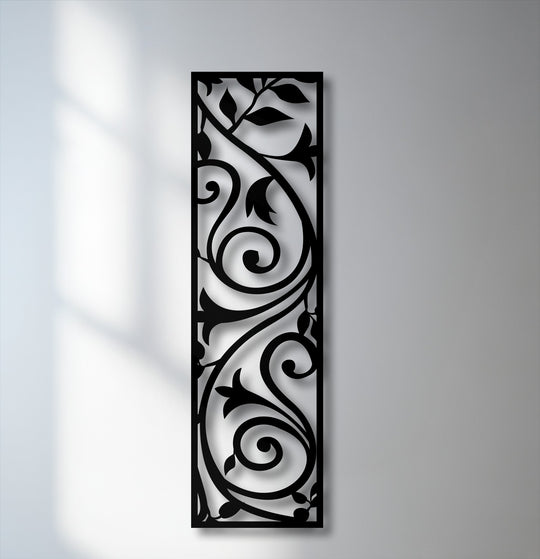 Deep black decorative metal art, an elegant vertical scroll vine panel, offers stunning botanical wall decor.