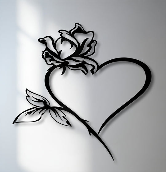 The smooth, matte surface texture of the black rose heart metal artwork casts a deep shadow, enhancing its dimensional presence.