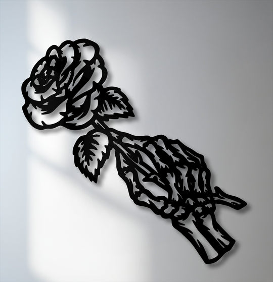 Light grey sets the backdrop for striking black gothic fading rose skeleton decorative metal art.