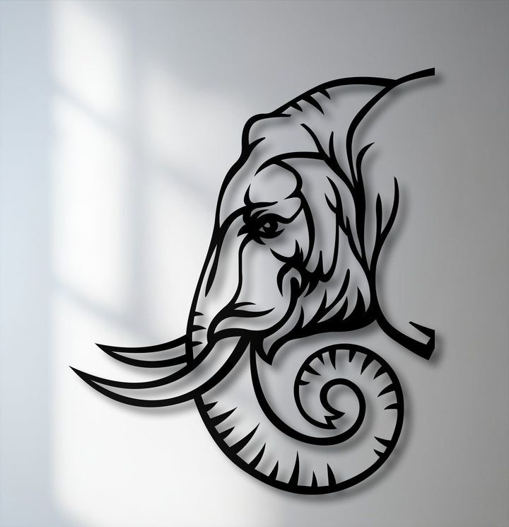 The illuminated, neutral gray wall provides a subtle backdrop, highlighting the intricate black lines of the decorative metal art.