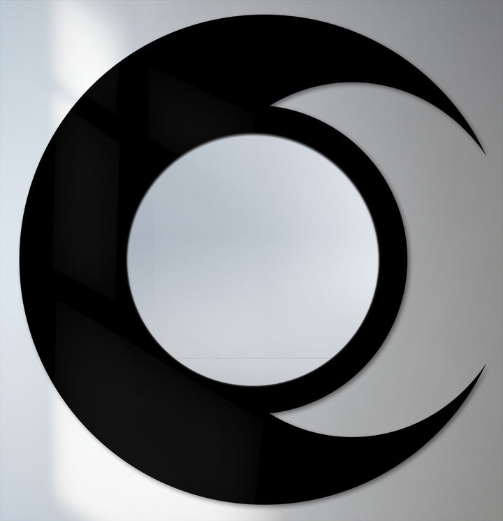 Transitioning shades define the celestial design of this round wall mirror, enhancing the modern metal wall decor with its crescent moon-inspired silhouette.