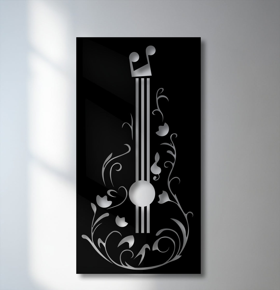 The sharp color contrast of the lustrous silver floral guitar design against the stark black metal art for wall is elegant and music-inspired.