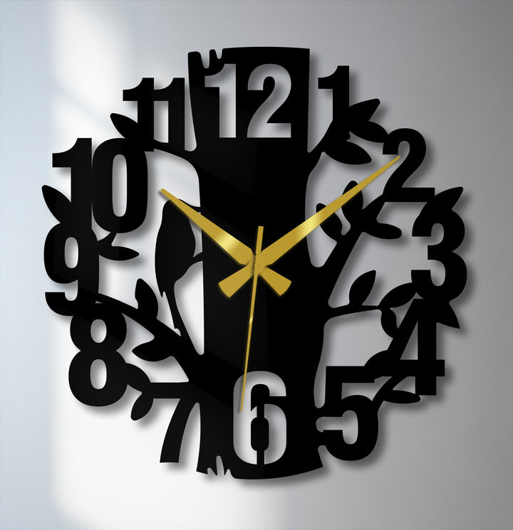 Showcasing the nature tree design, the modern metal artwork wall clock's bold numbers and gold hands command attention as the central subject.