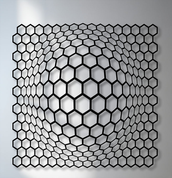 The negative space creates a striking 3D optical illusion of a curving hexagon grid, showcasing modern metal artwork.