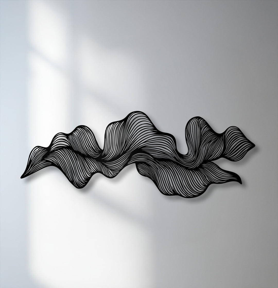 The bold, dark silhouette of the abstract wave flow metal decoration wall art creates a dynamic focal point with intricate lines.