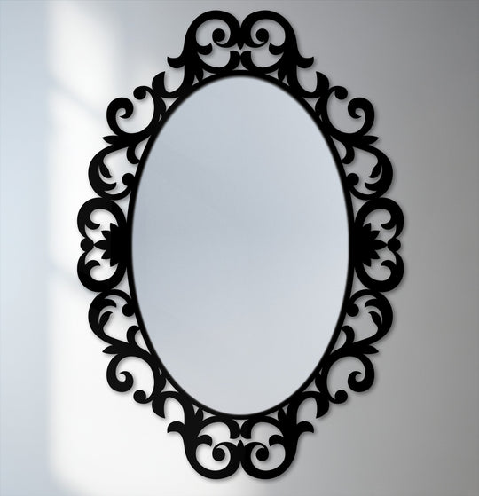 Swirling scrolls on the ornate oval frame suggest a sense of movement around this decorative bathroom mirror.