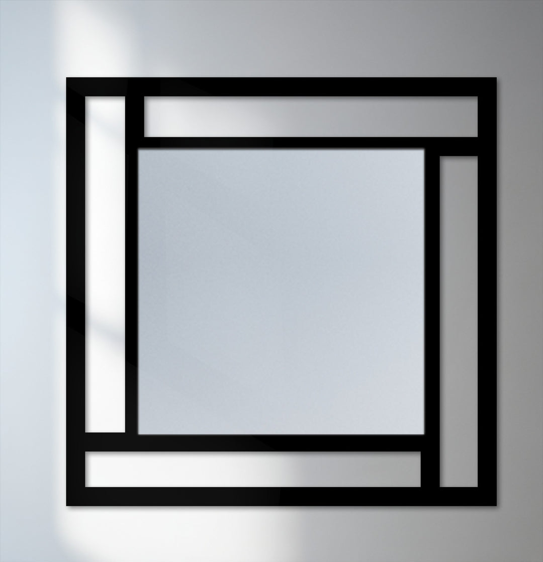 The darkest area of this framed geometry square mirror highlights the modern metal wall decor of the minimalist frame.