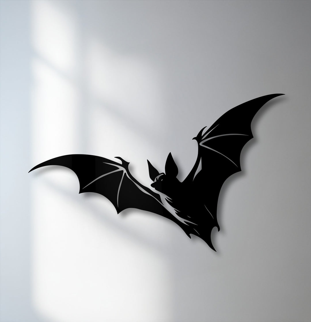 Striking color contrast highlights a flying bat silhouette in black, creating a bold piece of decorative metal art.