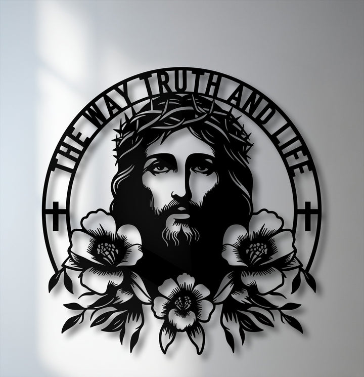 Foreground detail of unique metal wall art shows Jesus in a crown of thorns, with 'THE WAY TRUTH AND LIFE' text and intricate bottom flowers.