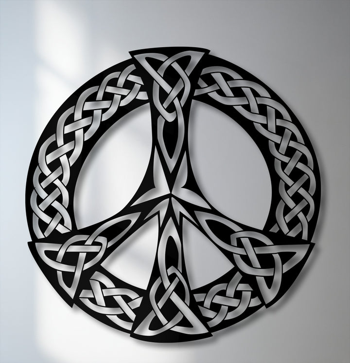 The stillness of the intricate black and silver Celtic knot peace symbol metal artwork elegantly portrays eternal serenity.