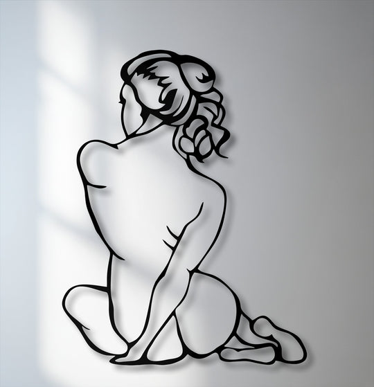 A serene and graceful silhouette of a female figure, embodying a contemplative mood as a unique metal wall art piece.