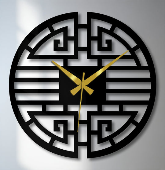 Striking color contrast highlights the unique metal wall art of this Asian geometric clock, featuring a bold black design against a lighter backdrop with elegant gold hands.