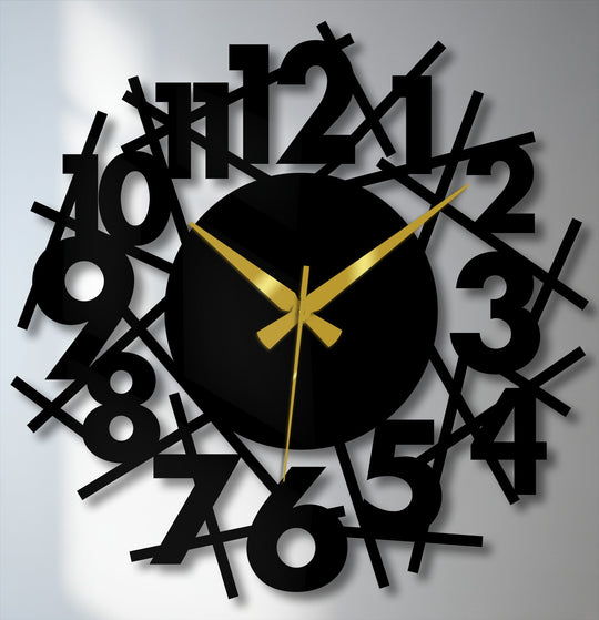 Shadowy edges soften the abstract numeric chaos of this modern metal wall clock, creating a unique metal wall art piece with scattered numbers and gold hands.